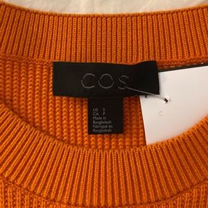 COS orange sweater